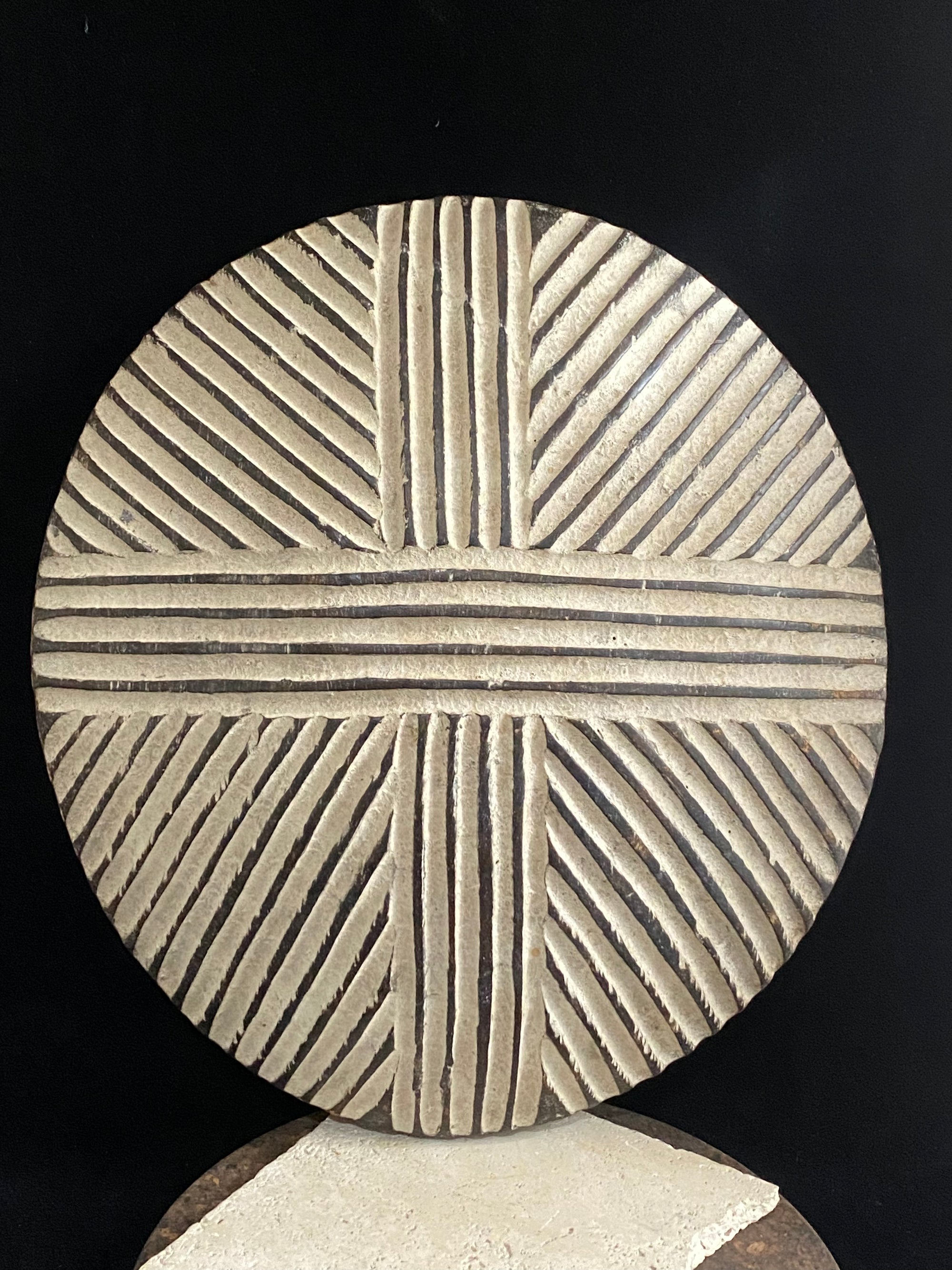 Round shield, Kuba people, vintage 1930's.  This shield features a patination of intersecting geometric lines and white pigment patina.  Measurements: diameter 42 cm, height approximately 6 cm