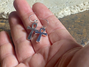 Stylish ankh earrings. The body of the earring is made from a non-tarnishing white metal indistinguishable from silver, while the hooks are sterling silver. Lightweight and easy to wear. Measurements: drop including hook 3 cm