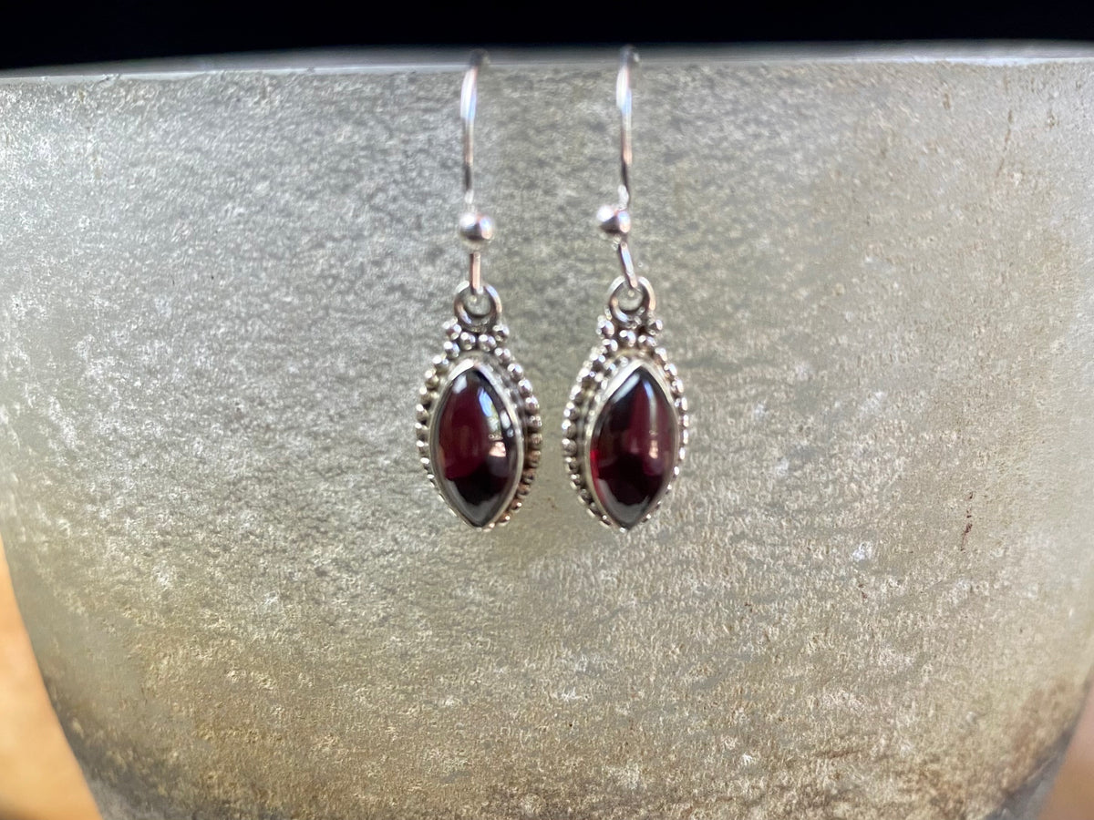 Simply elegant leaf shaped earrings with a beautifully detailed bezel to show off the natural beauty of the cabochon stones. Sterling silver hooks complete the look. Our earrings are open-backed to allow natural light to show through. Length including hook 2.7 cm