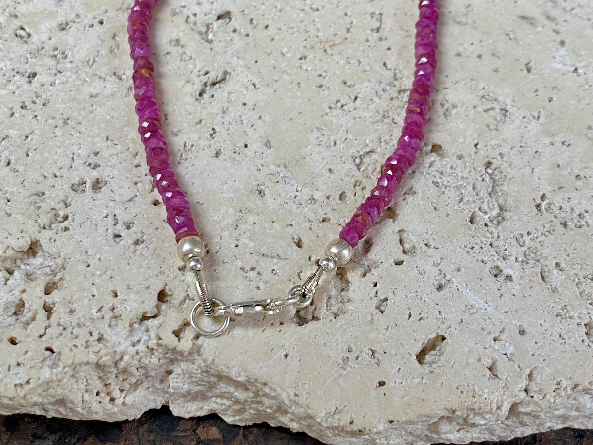 Beaded ruby necklace made up of finely graduated, matched facet-cut natural rubies. The necklace is finished with a sterling silver lobster clasp. This is a unisex necklace - perfect for men or women. Length 42 cm (16.5")
