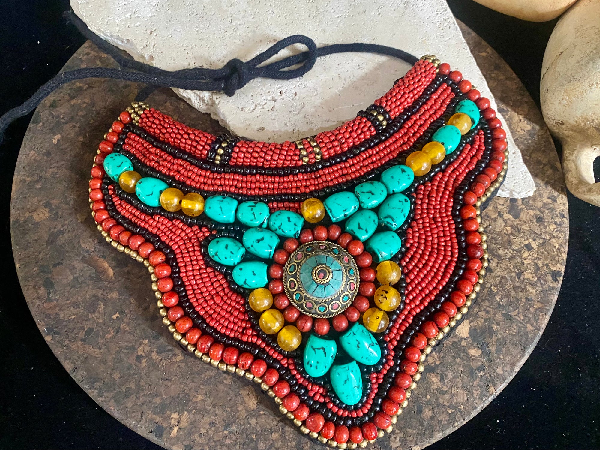 Traditional bib or pectoral beaded necklace, with a multitude of colourful ceramic and resin stones sewn onto a stiff fabric background and tied around the neck with a cord. Sikkim jewellery, India