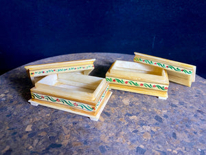 Small perfectly formed trinket or pill boxes, hand crafted from polished hand shaped panels of camel bone, which are then exquisitely hand painted with scenes of elephants. Set on small feet for real elegance. Length  7.5 x 4.5 cm, height 3 cm