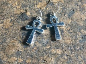 Stylish ankh earrings. The body of the earring is made from a non-tarnishing white metal indistinguishable from silver, while the hooks are sterling silver. Lightweight and easy to wear. Measurements: drop including hook 3 cm