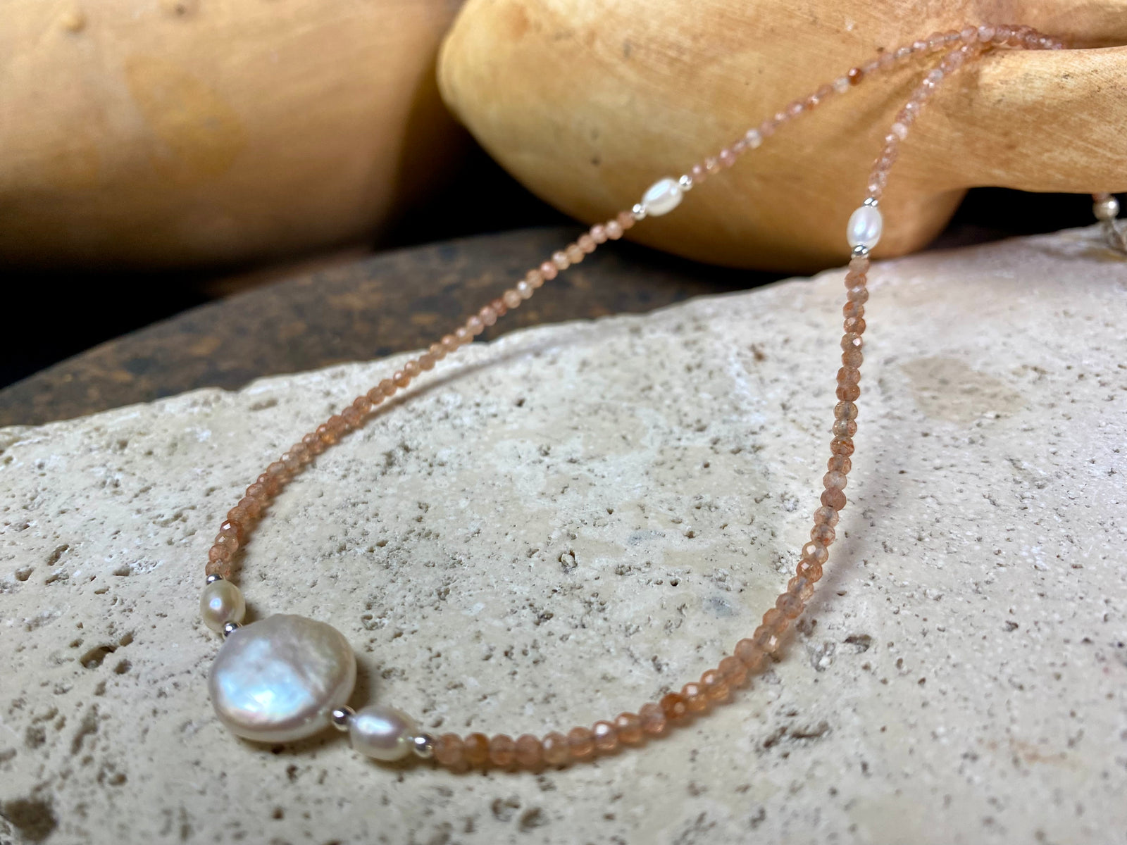 Natural clear pink/orange sunstone bead necklace is teamed with cultured pearls and sterling silver detailing. A silver lobster clasp complete the look. Length 40.5 cm