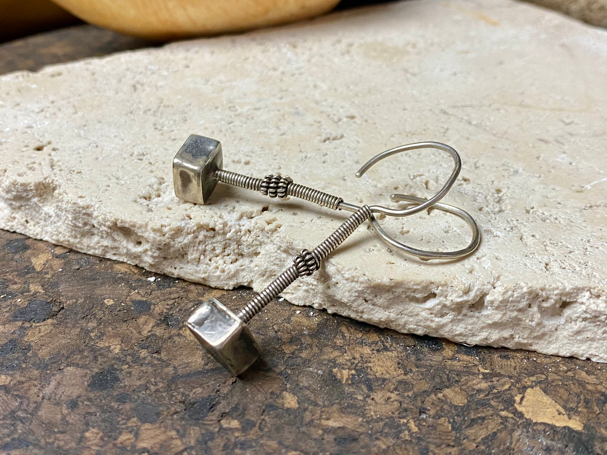 Rabari tribal earrings. High grade silver. Hollow construction, lightweight and easy to wear. Mid 20th century. Traditionally worn in both the ear lobe and in the upper cartilage of the ear. Length 5.8 cm