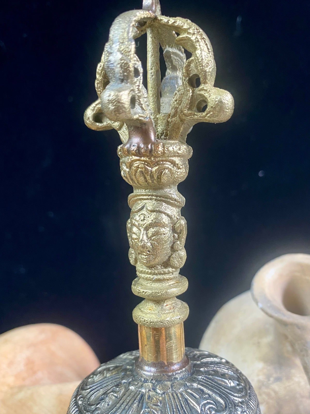 Tibetan Buddhist bells in two sizes. They feature fine detailing, are encircled with the mantra Om Mani Padmi Hum and are topped with the image of the Buddha and the dorje. These very high quality bells have a beautiful tone, the larger is deeper and richer, the smaller is higher and sweeter. Please watch our two videos to hear their sound.  Measurements:  Large: height 16 cm, diameter 9 cm Small: height 13 cm, diameter 7.5