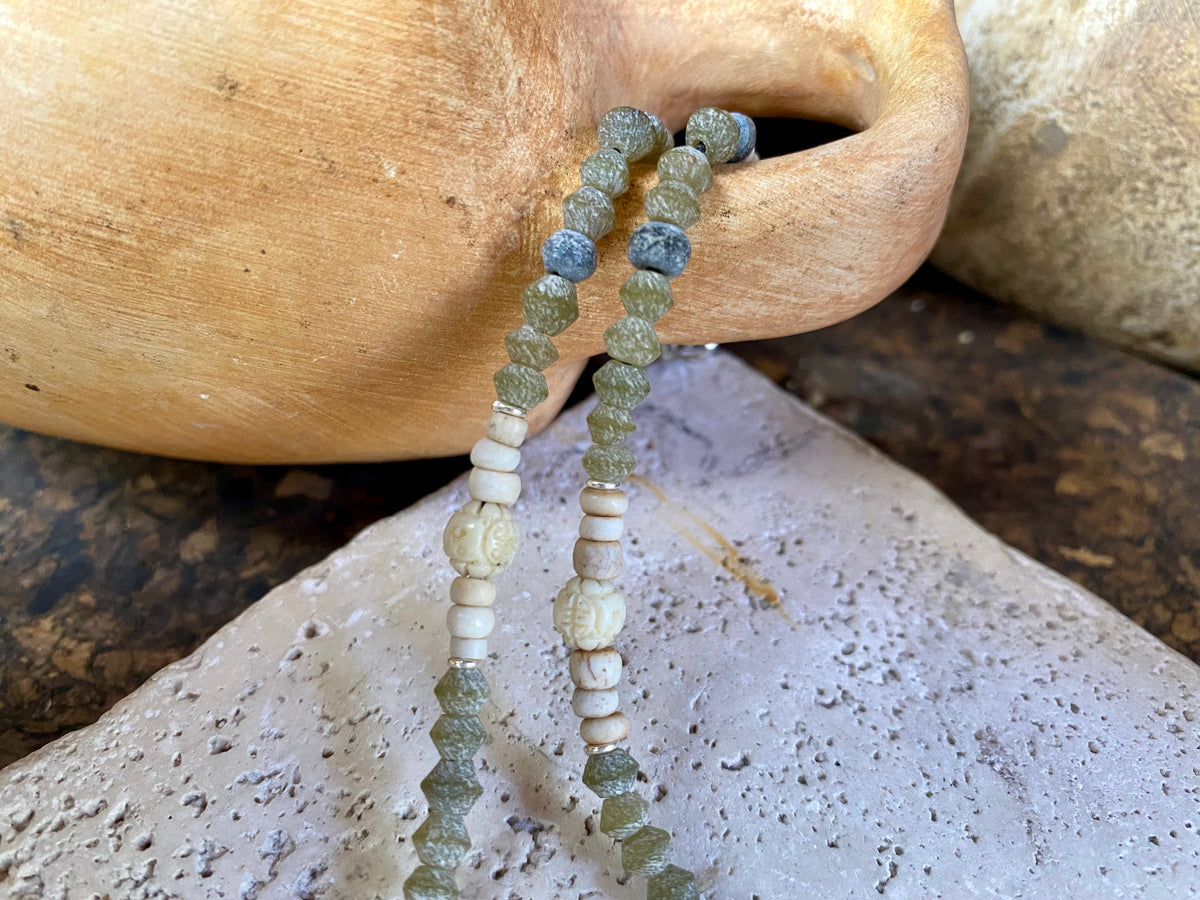 Tribally inspired stone necklace featuring prehnite, jasper, lotus root, carved white coral , glass and sterling silver.  Length 39.5 cm