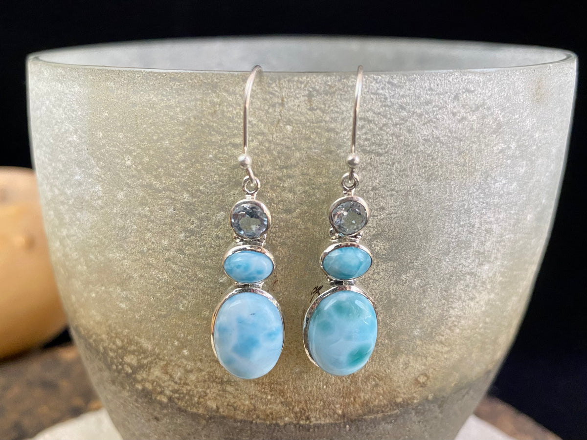 Larimar stone earrings set in sterling silver. Each pair of earrings is unique, cut and mounted to showcase the beauty of the individual stones.