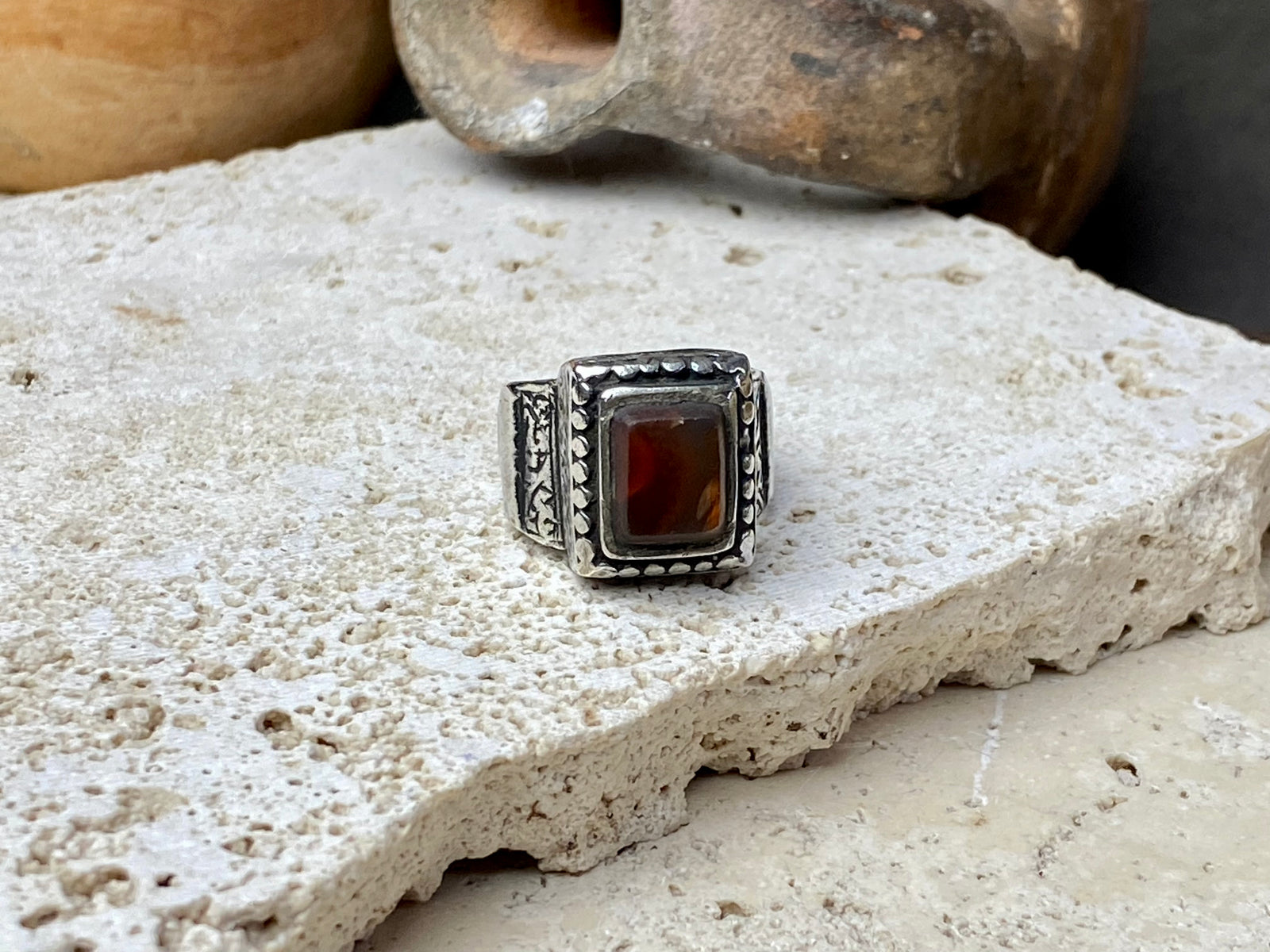 An elegant ring featuring a beautiful dark carnelian stone. The stone shows some wear commensurate with its age. Afghanistan, early to mid 20th century. Can be worn by either men or women. Measurements: Ring face 1.6 x 1.3 cm, inner diameter 18.5 mm | Size 8.5 | No 19