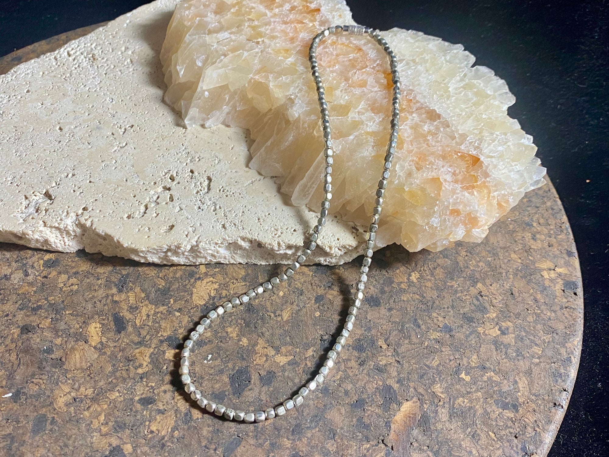 Tribal bead necklace. White metal screw clasp. Wear one or wear them stacked with more of the same or other necklaces, wear it with a pendant or on its own. Wrap it round your wrist as a bracelet. These solid and weighty silver colour beads are handmade in western India. Measurements: 40-41 cm length