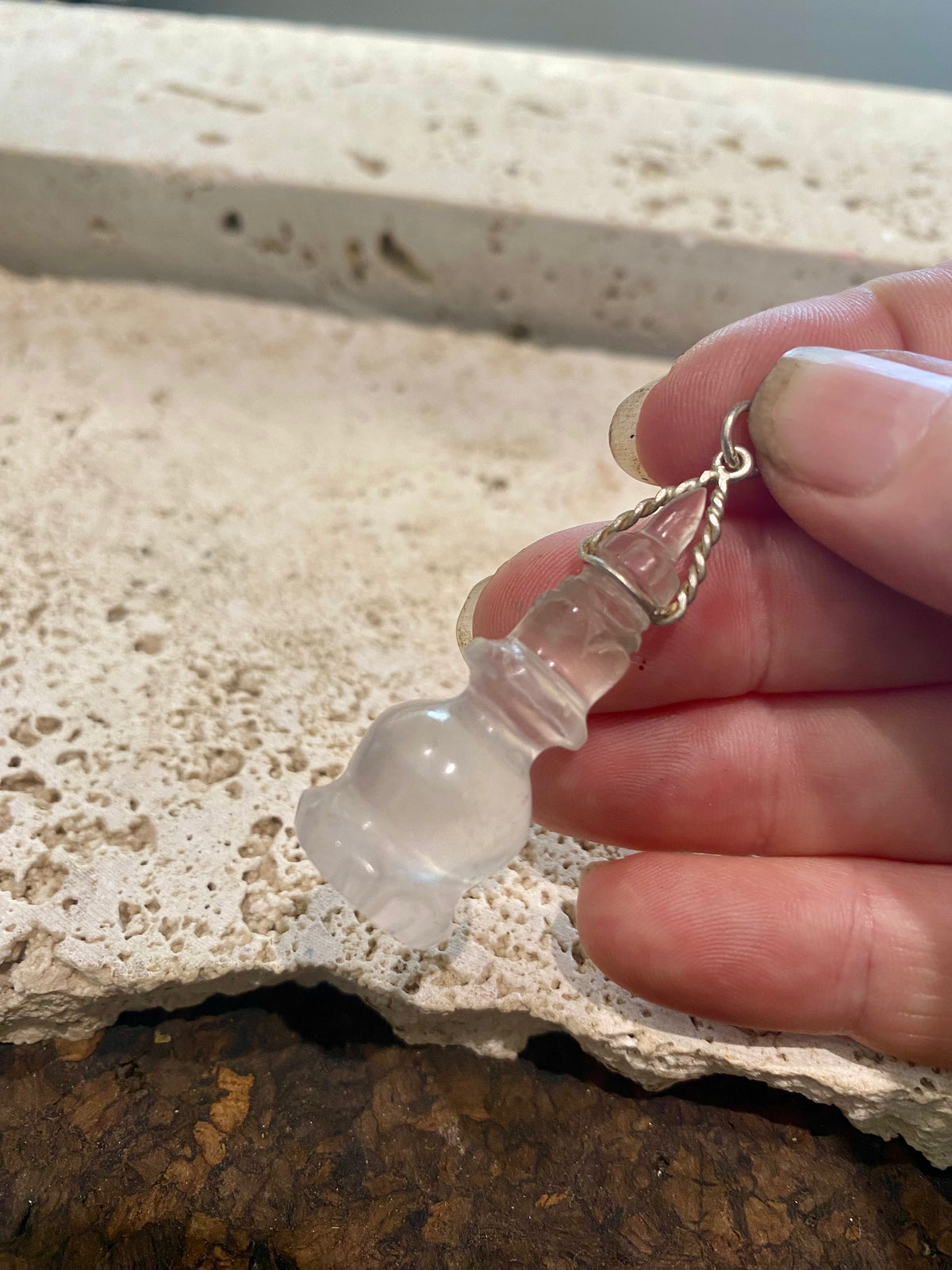Hand carved rock crystal featuring the Buddhist stupa. Sterling silver bail. A stunning unisex pendant, would look beautiful on anyone.   Measurements: length including bail 4.7 cm, width 1.7 cm