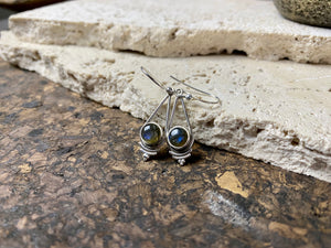 Simply elegant earrings with an art deco style, crafted from natural cabochon gemstones. Sterling silver surrounds and hooks complete the look.  Length including hook 4.7 cm 