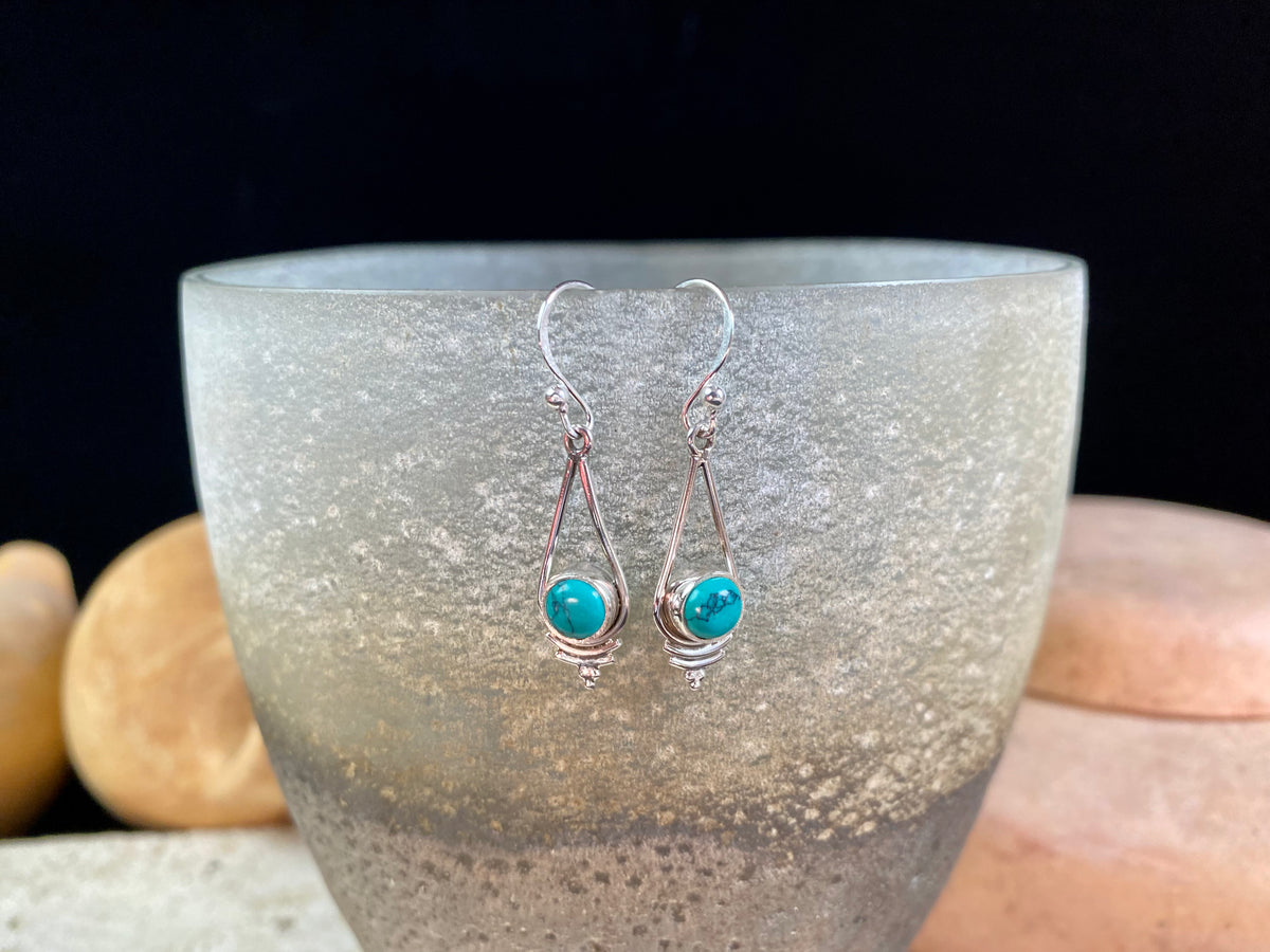 Simply elegant earrings with an art deco style, crafted from natural cabochon gemstones. Sterling silver surrounds and hooks complete the look.  Length including hook 4.7 cm 