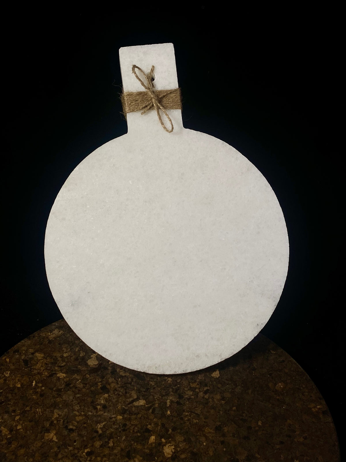 Our simple marble plate is designed for serving nibbles or for use as a cheeseboard. However, its simplicity means that it would also make a very nice plant or object stand. Hand carved in Rajasthan from white marble. A simple handle with hole for hanging completes the look. Measurements: length 29 cm, 21.5 cm disk diameter