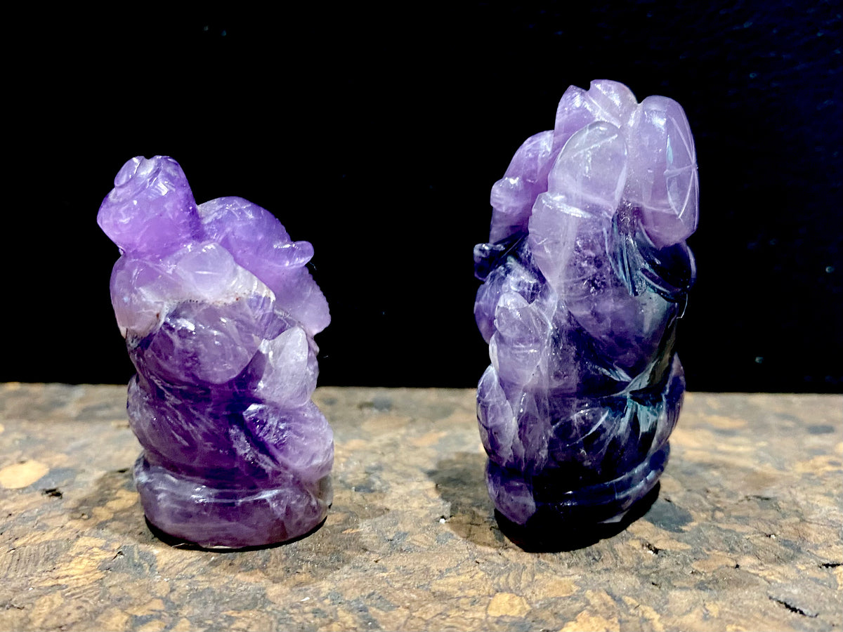 Hand carved from high quality, solid chunks of amethyst crystal, measurements: Large - 4.3 cm height, width at base 3 cm, Small - 3.7 cm height, width at base 2.6 cm