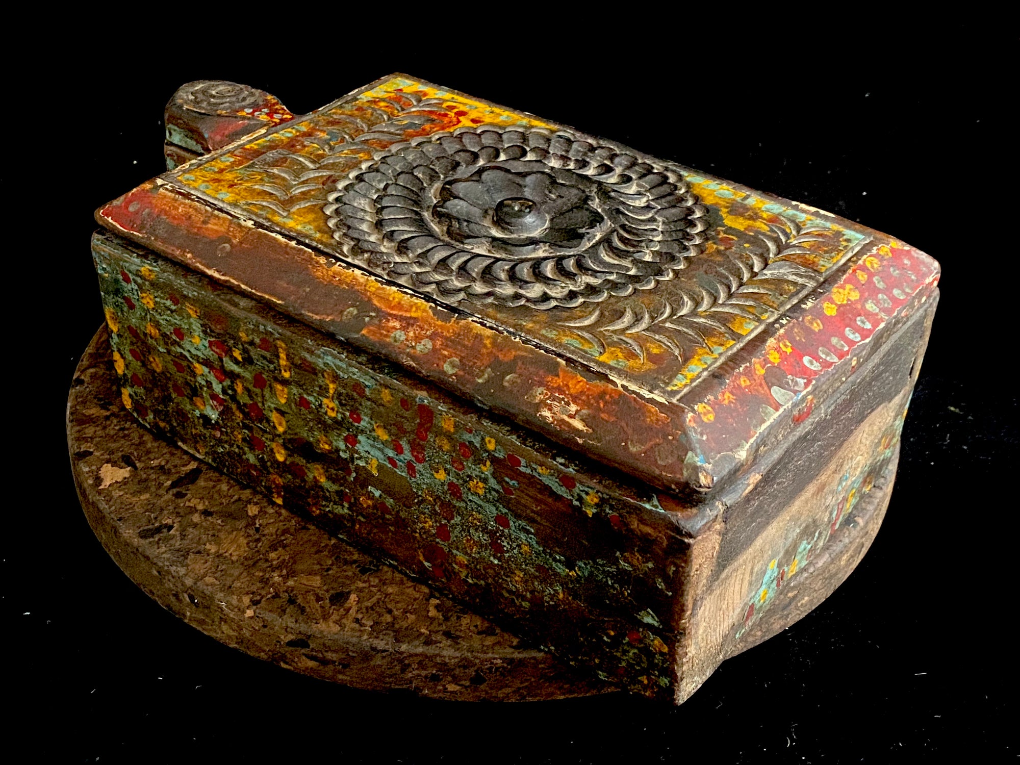A lovely old southern Indian spice box with carved top, hand painted and swivel lid. Made from teak. Two compartments. This would make a lovely trinket box, key box, jewellery, watch or cufflink box. Circa 1880 - 1920. Handmade in southern India. Measurements: length 26 cm; depth 15 cm, height 9 cm.