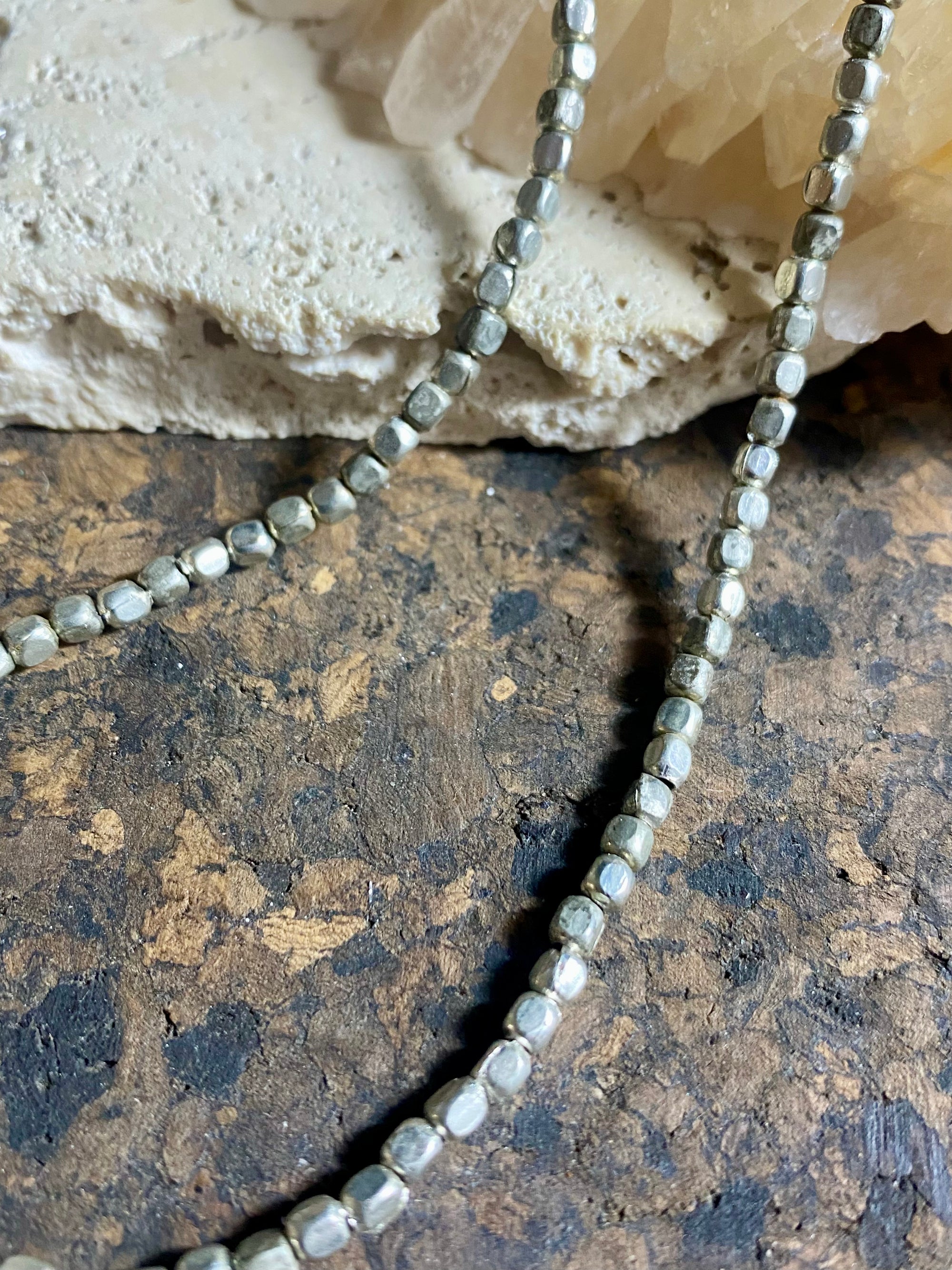 Tribal bead necklace. White metal screw clasp. Wear one or wear them stacked with more of the same or other necklaces, wear it with a pendant or on its own. Wrap it round your wrist as a bracelet. These solid and weighty silver colour beads are handmade in western India. Measurements: 40-41 cm length