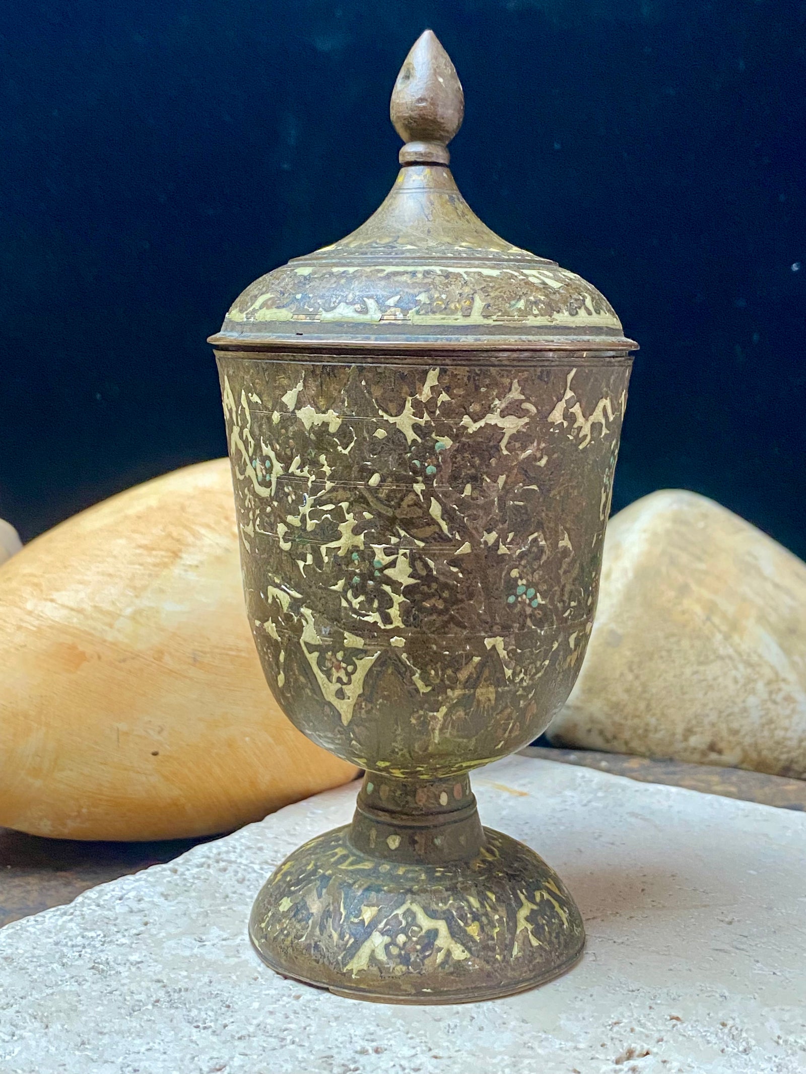 Russian Orthodox church communion chalice. Early 20th century. Engine turned brass with elaborate inlay enamel decoration in white with blue and red highlights. The enamel work is very worn and rubbed in places. Height 15 cm, width 6.5 cm.