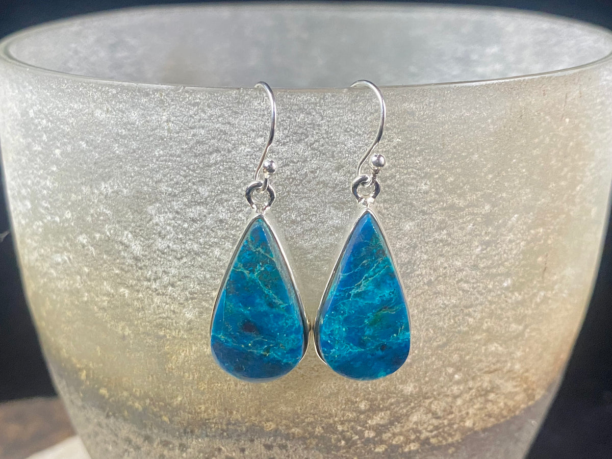 Our stunning earrings feature vibrant, perfectly matched azurite cabochon stones set in sterling silver bezels. Finished with sterling silver hooks. 4.3 x 1.3 cm