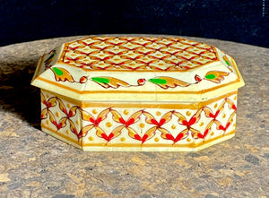 A compact trinket box, hand crafted from wood overlaid with polished hand shaped panels of camel bone, which are then exquisitely hand painted. Measurements 10 x 8 cm, height 4 cm