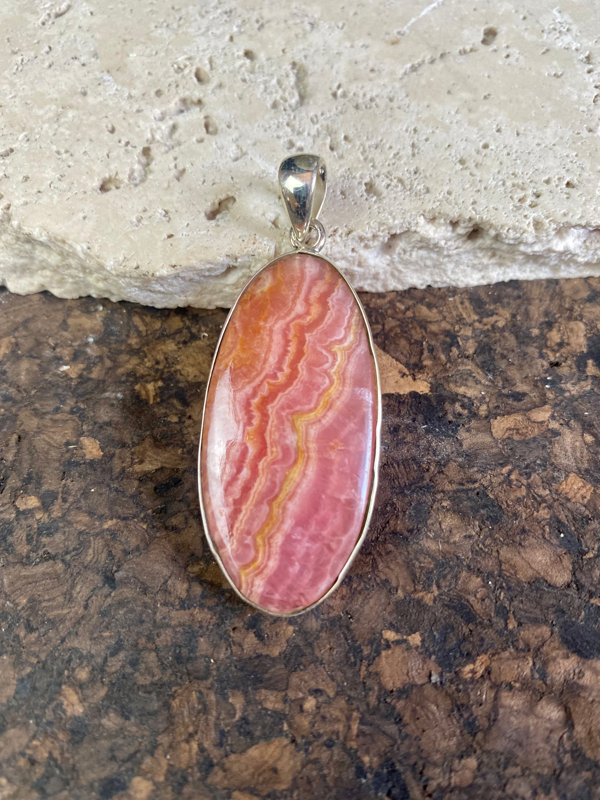 The most beautiful rhodochrosite we've ever seen. Every piece tells a story, all set in sterling silver bezels with generous bails to take the largest of chains or cords. These are beautiful statement pieces of jewellery.