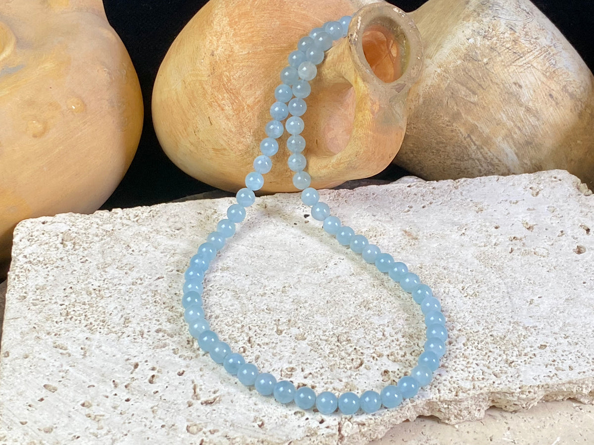 Natural aquamarine necklace featuring round aquamarine beads and a sterling silver clasp.   The aquamarines are matched a light and even blue of beautiful quality. Measurements: 47.5 cm