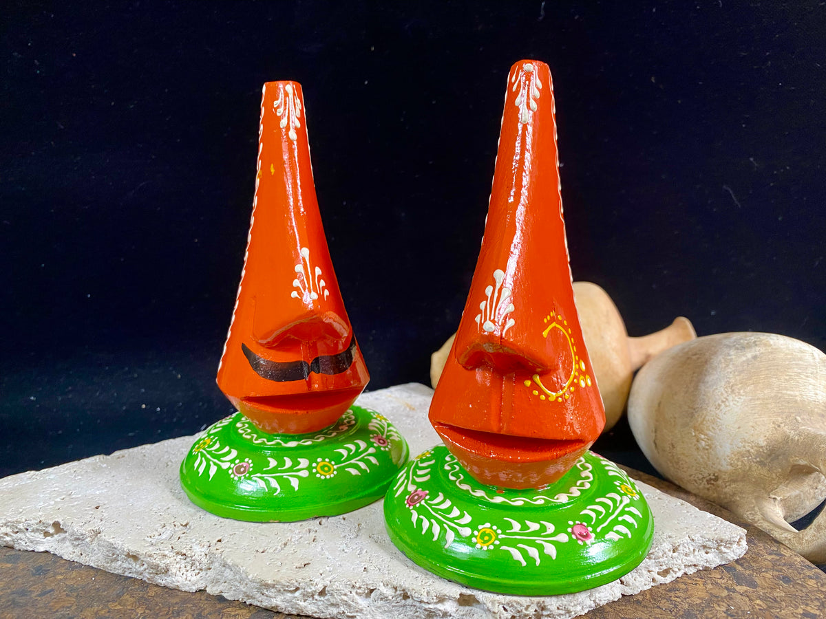 Always losing your glasses and sunglasses at home? We have the solution. Hand crafted from lightweight wood, these very cool little guys are traditionally called chasma stands and they will make sure you never misplace your sunglasses or glasses again. From India Measurements: height 15 cm