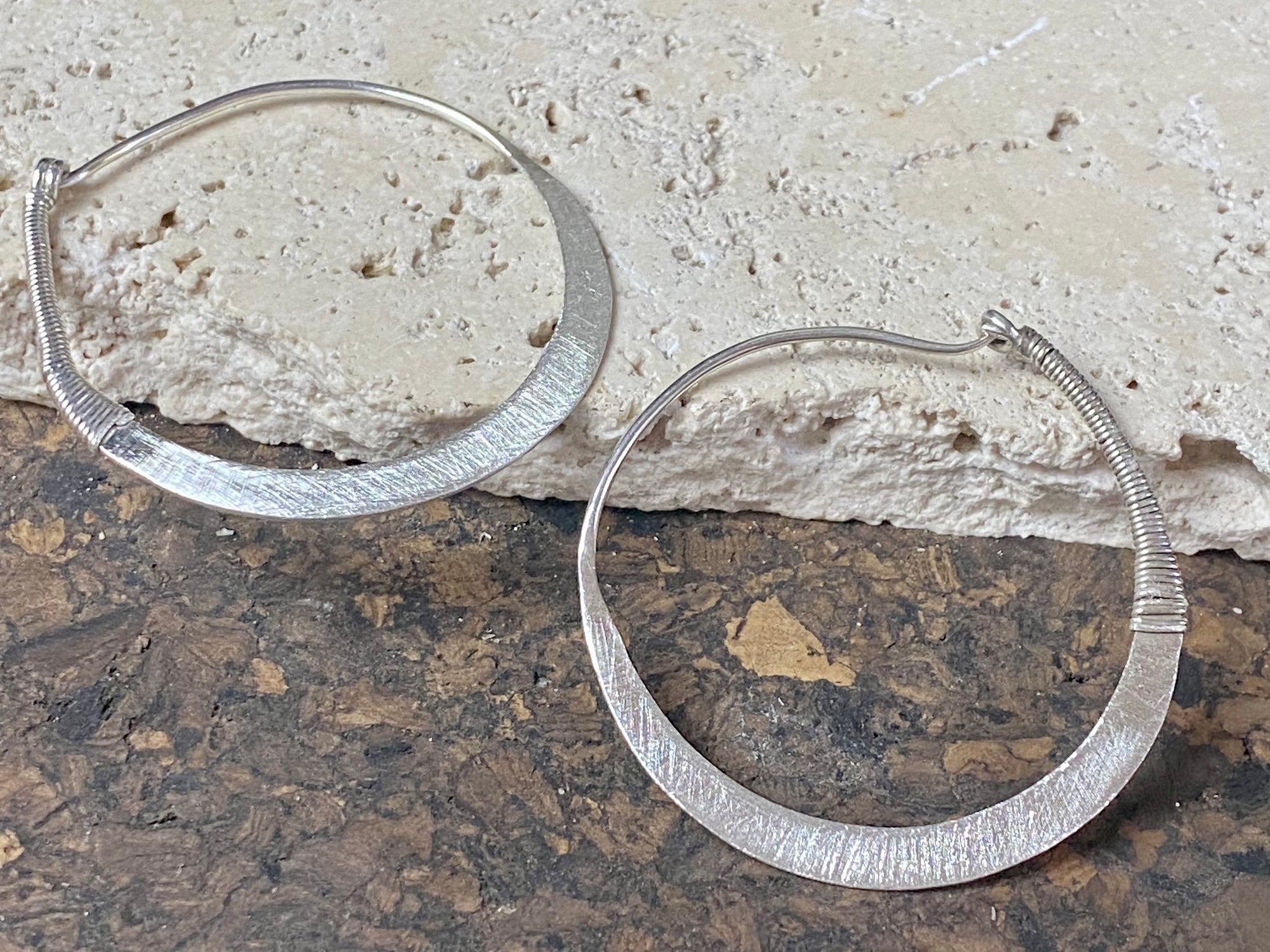 Hand made tribal sterling silver hoop earrings with wrapped silver wire detailing. 4.5 cm diameter