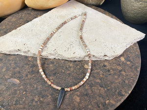 Our men or women's necklace is made from rondel cut quartz drusy beads, highlighted with Kachin Burmese shell beads and a pendant made from unpolished onyx. Finished with a sterling silver hook clasp. Measurements: Total length including clasp 43.8 cm (17.25”), height of onyx pendant 3 cm