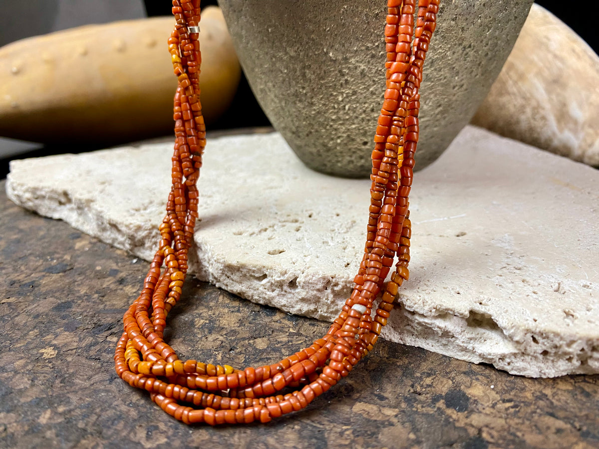 Our long tribal multistrand necklace is made with  antique ceramic beads worn by the Bonda people of the Himalayas. This five strand red-brown-orange necklace is finished with a handmade sterling silver clasp and features sterling silver bead detailing.   Measurements: 66 cm  length