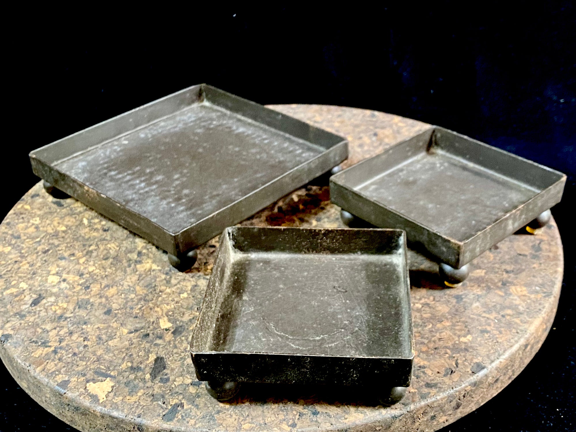 Black iron, footed candle trays
