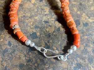 A stunning necklace of graduated antique red coral from the Himalayas, purchased in northern Thailand in 2004 and finished with a sterling silver clasp. This strand has 88 beads including a magnificent centre bead and weighs 55 grams. Length 45.5 cm