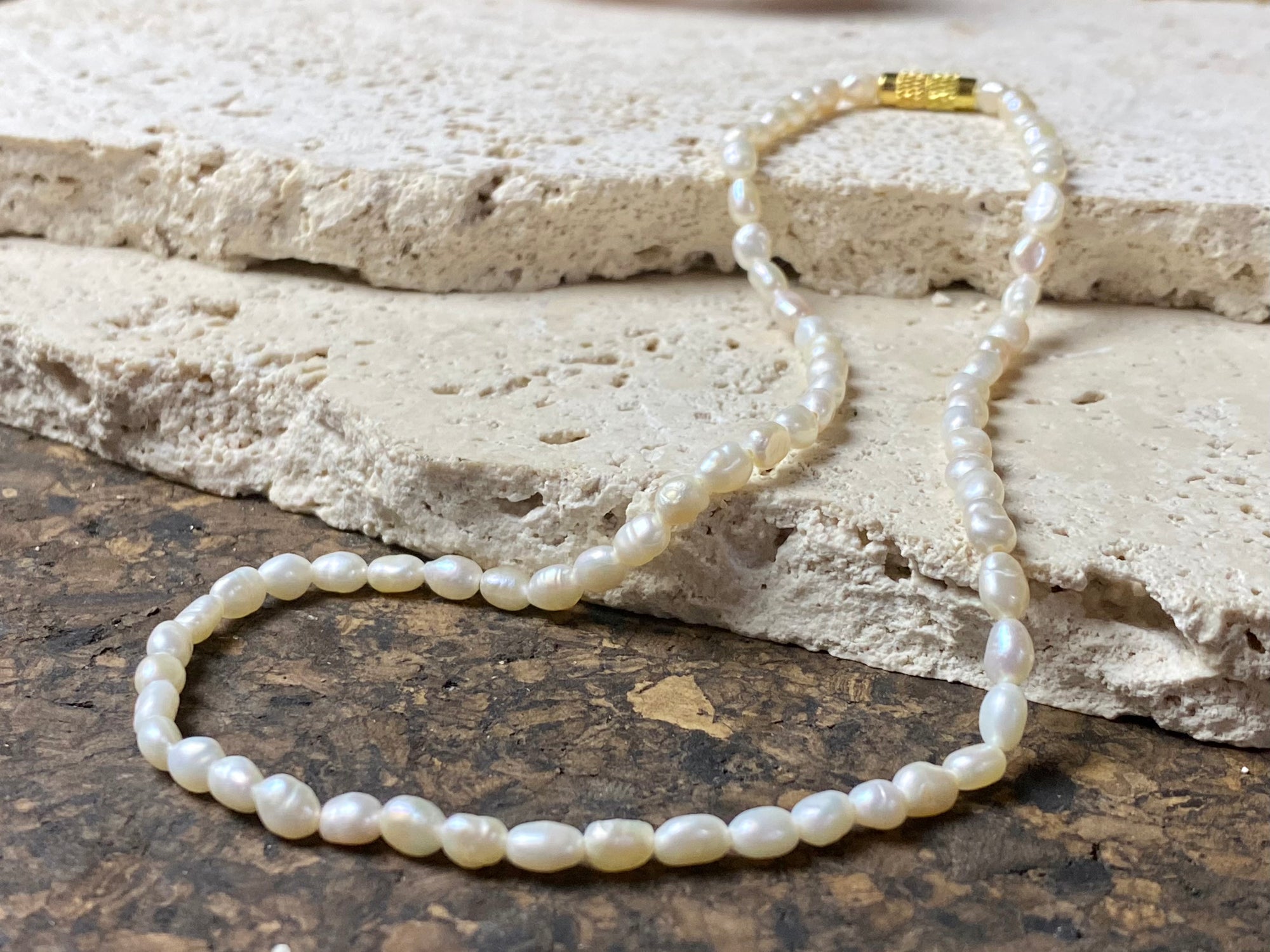 A simple pearl choker necklace, finished with a brass barrel clasp.  These are cultured freshwater pearls.  Measurements: length 38 cm including clasp 
