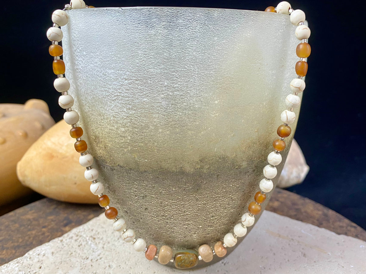 Our unique statement necklace features beautiful vintage beads from the Kashgar collection - turquoise centre bead, jasper beads from the Philippines, howlite beads, buffalo horn beads and  925 sterling silver detailing and lobster clasp. Length 45 cm.