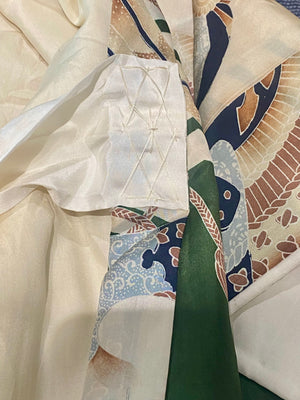 Small, hand sewn child's kimono suitable for either sex. A tasteful design features greens, tans, navy, lilac and pale blue colours in an abstracted design reminiscent of its era. Padded and lined. Hand stitched silk ties with fine thread tassel detailing. No damage, excellent condition. Circa 1950's.