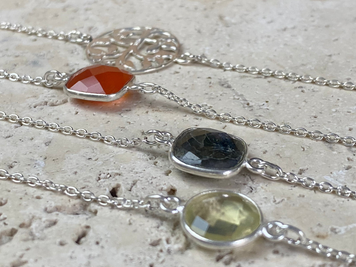 Elegant bracelets set with single stones in a sterling silver chain and clasp. Note that these bracelets are adjustable in length to suit your wrist size  Measurements: 17.2 - 19.8 cm length