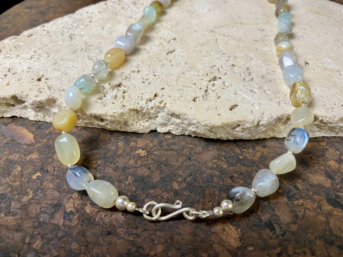 Striking boulder stone translucent blue opal necklace with sterling silver bead detailing, finished with a sterling silver hook clasp. Length 45.5 cm