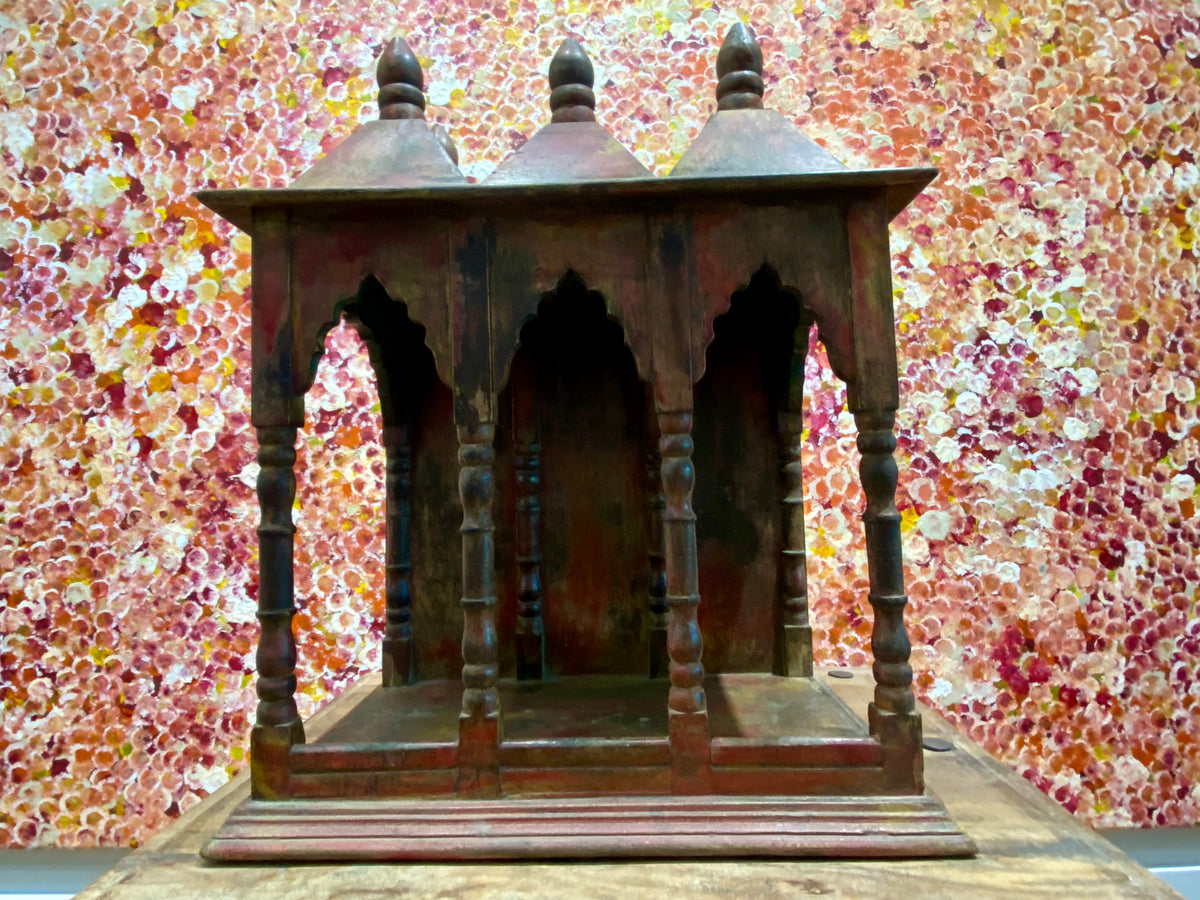 Solid timber shrine, nicho or display box, with three sections or bays,  beautifully carved and finished on three sides and inside with carved pillars, solid wood back, stepped up footing and peaked roof with finial. Most likely teak. Dates from the 1950-60s, southern India. Height 47.5 cm, depth 25 cm, width 38 cm