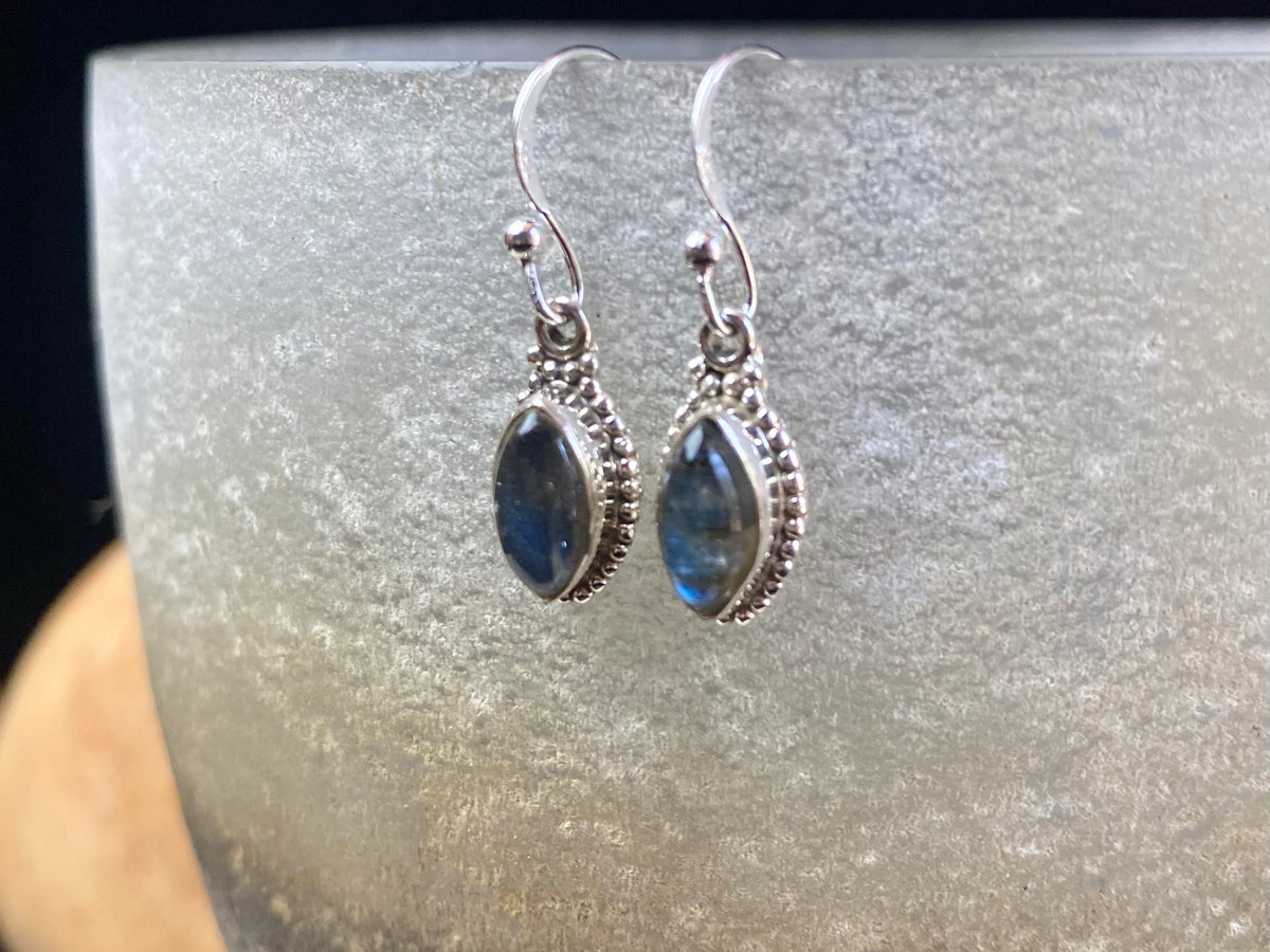 Simply elegant leaf shaped earrings with a beautifully detailed bezel to show off the natural beauty of the cabochon stones. Sterling silver hooks complete the look. Our earrings are open-backed to allow natural light to show through. Length including hook 2.7 cm