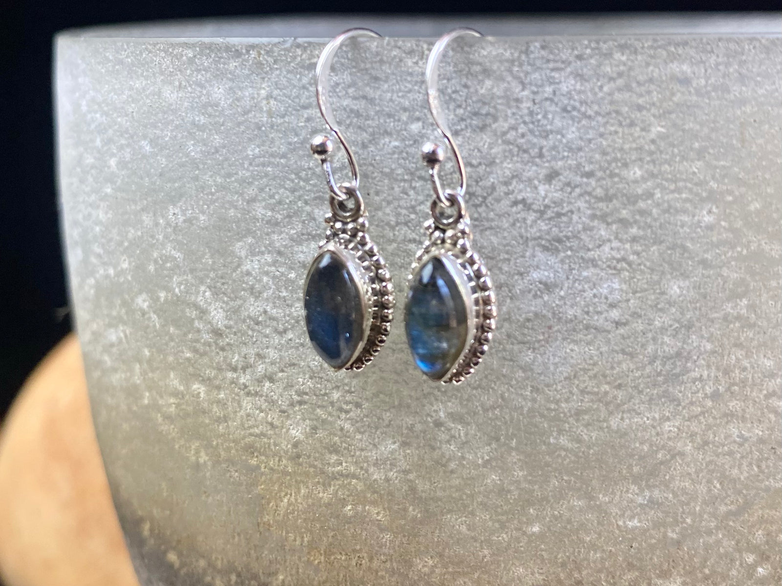 Simply elegant leaf shaped earrings with a beautifully detailed bezel to show off the natural beauty of the cabochon stones. Sterling silver hooks complete the look. Our earrings are open-backed to allow natural light to show through. Length including hook 2.7 cm