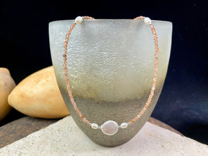 Natural clear pink/orange sunstone bead necklace is teamed with cultured pearls and sterling silver detailing. A silver lobster clasp complete the look. Length 40.5 cm
