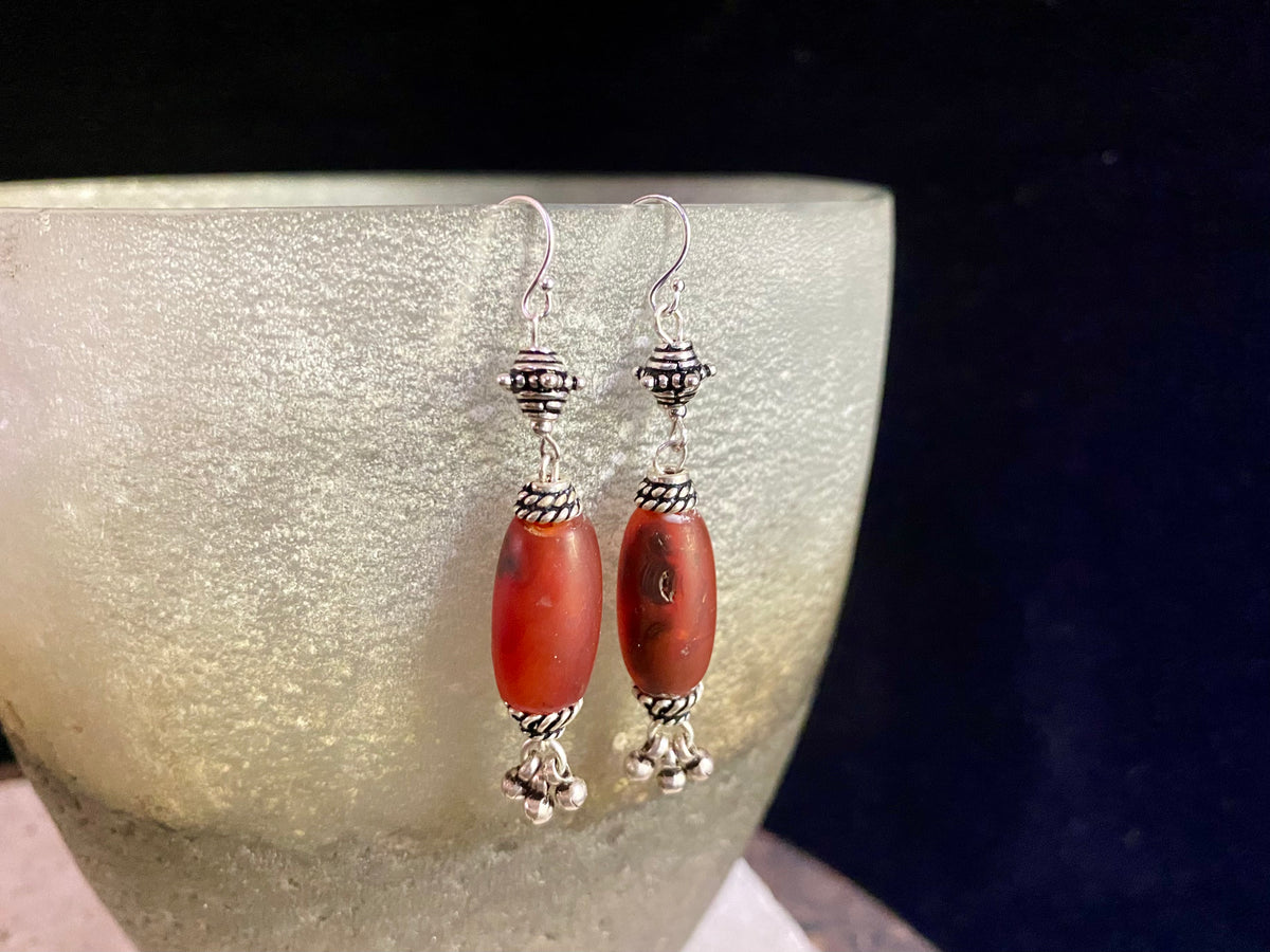 Beautiful long drop earrings combine antique carnelian stones with handmade Indian silver beads and sterling silver hooks. Carnelian stones from Nepal, 5.8 cm length