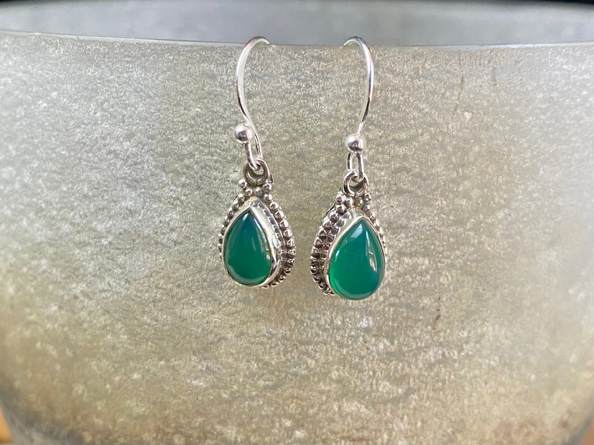 Elegant teardrop shaped earrings with a beautifully detailed bezel to show off the natural beauty of the cabochon stones. Sterling silver hooks complete the look. Our earrings are open-backed to allow natural light to show through. Length including hook 2.7 cm