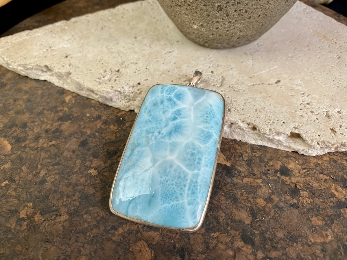 Larimar stone pendants set in sterling silver. Each pendant is unique, cut and mounted to showcase the beauty of the individual stones.