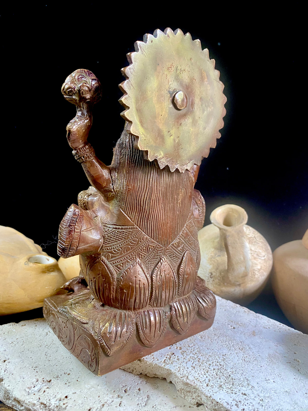 A statue of the goddess Laxmi (or Lakshmi), Hindu goddess of wealth and prosperity. Cast from solid brass, her features are exquisitely detailed, while her face, hands and feet are polished. Her right hand is raised in the gesture of protection and her left hand holds a pot symbolising abundance. Measurements: 19.8 cm height, width12 cm, depth 8.3 cm