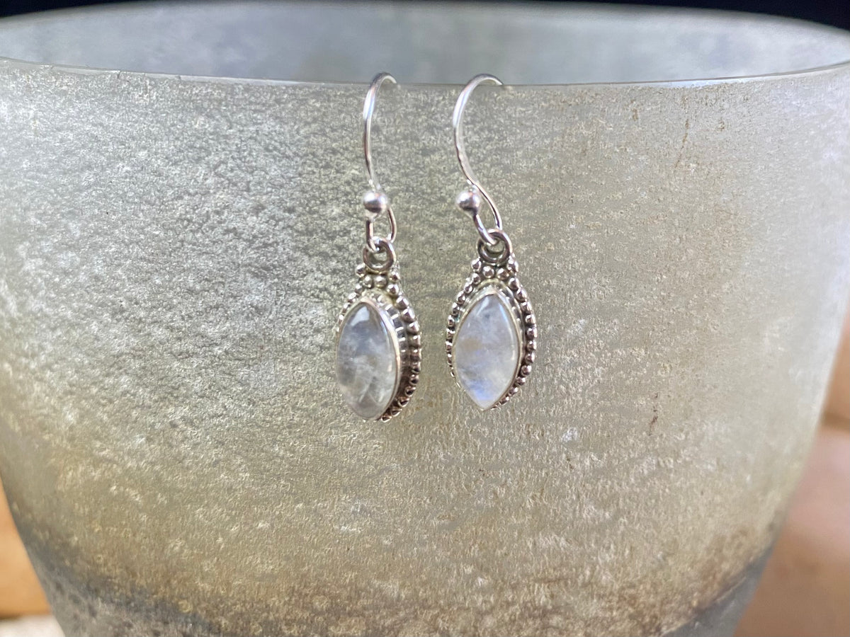Simply elegant leaf shaped earrings with a beautifully detailed bezel to show off the natural beauty of the cabochon stones. Sterling silver hooks complete the look. Our earrings are open-backed to allow natural light to show through. Length including hook 2.7 cm