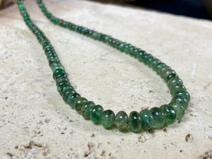 A classic necklace of graduated, matched natural emeralds featuring sterling silver findings and hook clasp. 70 carats of emeralds, length 45.5, bead size 2 mm - 6 mm
