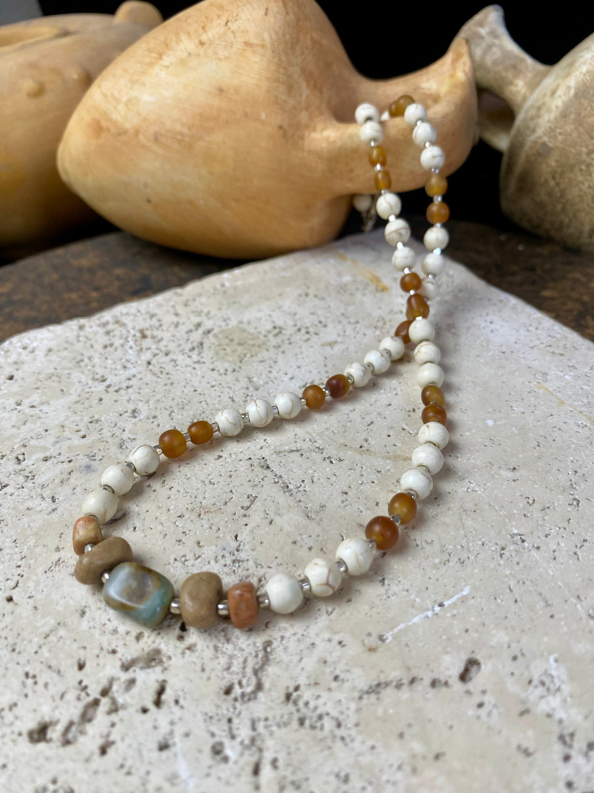 Our unique statement necklace features beautiful vintage beads from the Kashgar collection - turquoise centre bead, jasper beads from the Philippines, howlite beads, buffalo horn beads and  925 sterling silver detailing and lobster clasp. Length 45 cm.