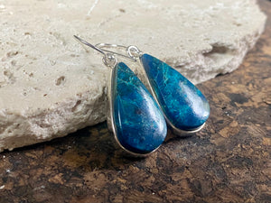 Our stunning earrings feature vibrant, perfectly matched azurite cabochon stones set in sterling silver bezels. Finished with sterling silver hooks. 4.3 x 1.3 cm