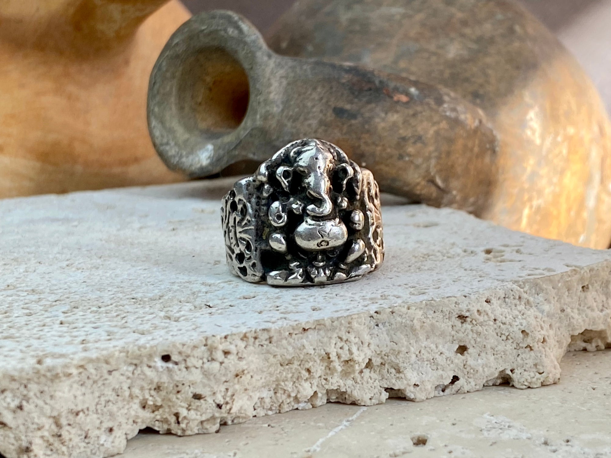 Vintage silver Ganesh ring from Rajasthan, India, weighing over 15 grams. A beautiful depiction of Lord Ganesha with small open piercings to each side of Ganesh and an image of the Tree of Life on the back. This is a stunning silver ring that can worn by men or women. Ganesh: 2 x 1.7 cm Size: 18.25 mm| Size 8